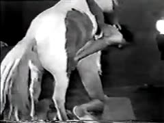 An attractive American woman is having her first sexual encounter with her brother's horse.